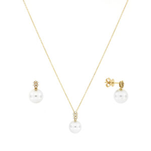 Juego de broquel con dije de perla en oro amarillo